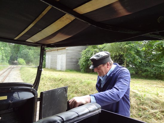 Adrian getting into his Ford  T inspection saloon, to give Bridget Eickhoff a ride at the Beeches Light Railway.