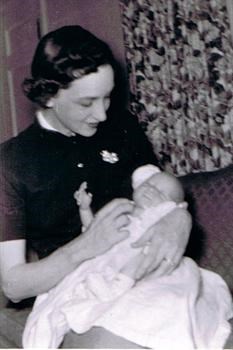 Margaret holding Bob 1956
