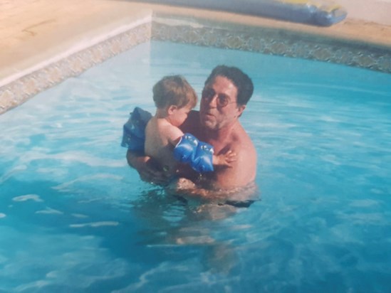 Grandpa teaching Sam to swim