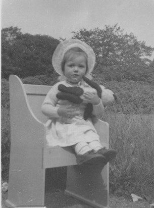 An early and rare attempt at sitting still and doing as she was told.