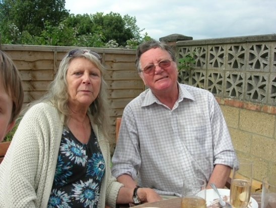 Dad and Glen sat in garden