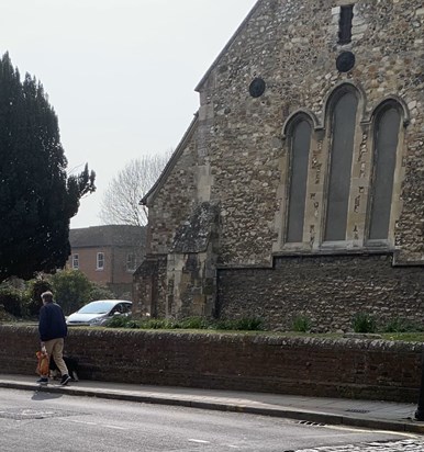 Dad walking past St Faith's Church in Havant