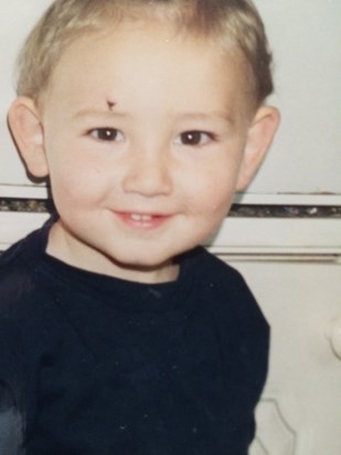 Gorgeous brown eyed little boy.