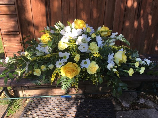 Dads floral tribute have been placed at the door of his workshop