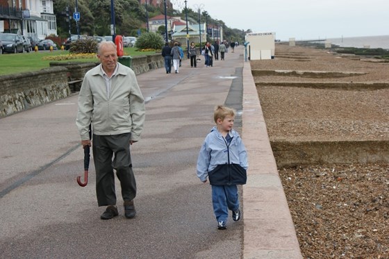 John walking at Felixstowe with his grandson, Matthew