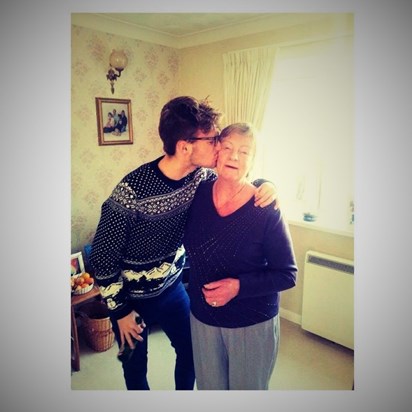 Charlie surprising his Nan with a cuddle and kiss