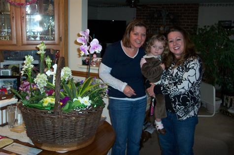 Sharon with her cousin Kerry and niece, Molly. Sympathy flowers by Kerry.