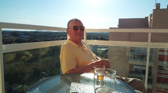 John on balcony in El Campello, Alicante, Spain