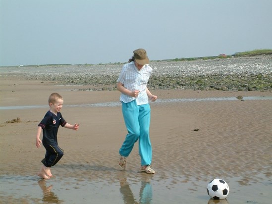 Adam and Nan playing football 