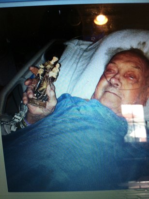 My dad with the St.Anthony statue I bought him when he was in ICU 2014