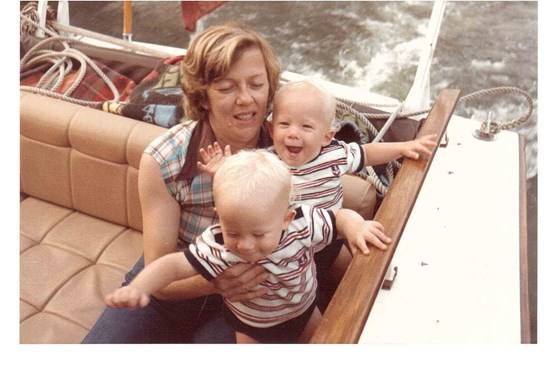 Very apprehensive mother on boys first boat ride