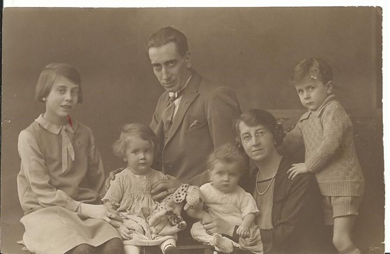 Dad with his mum, dad, sisters & brother, dad is the small one sitting on his mum's knee.