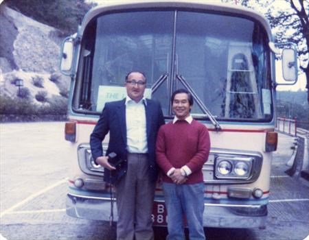 dad with a bus and driver in hong kong