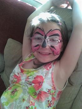 Abbie with her face painted as a Butterfly