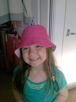 Abbie in one of her many hats