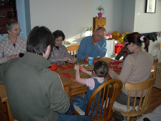 Three generations undergoing Christmas preparation