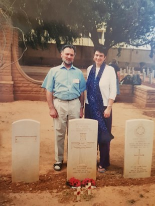 Geoff and Liz visiting Geoff's father's grave in Benghazi Military Cemetery, Libya, in 2000