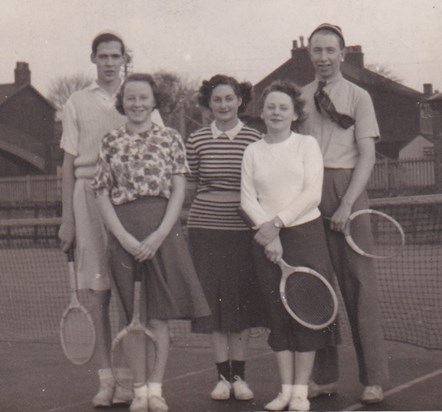 A young man and his tennis buddies