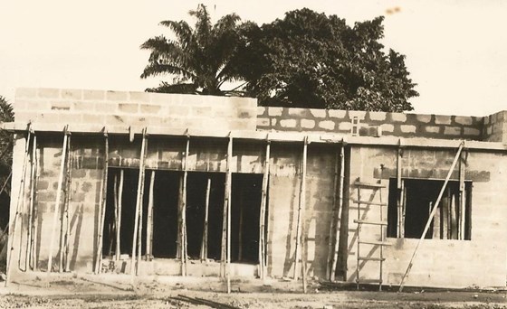 Amans building his house in the village