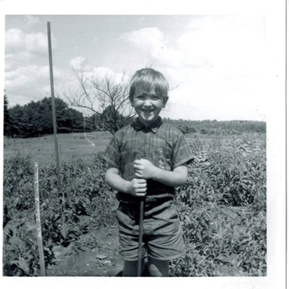Dennis gardening at age seven.