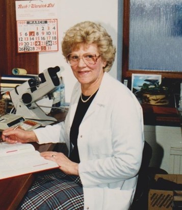 Kathleen fitting glasses for clients, when she worked at Clarks Opticians. 