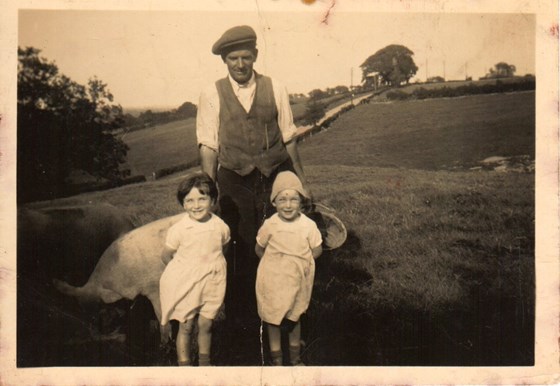 Grandad Stealey, Mary & Betty in field at Leigh feeding pig