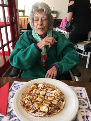 Mum enjoying a pancake, winter 2019