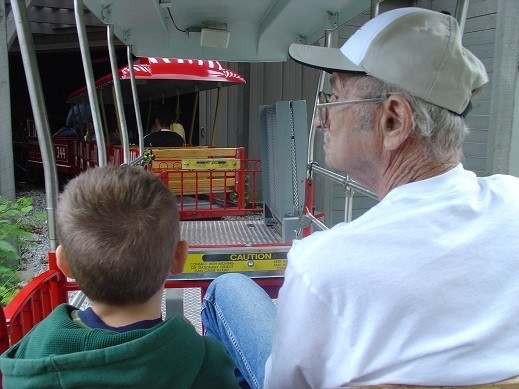 Trent and Pappy riding the train together