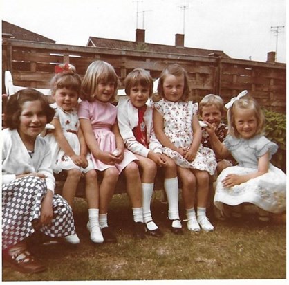 Susan on the far right, looking as pretty as a picture at one of my birthday parties. I loved that dress. I'm the one with the red ribbon in my hair. Sally