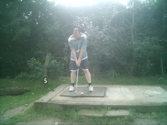 Carl playing golf