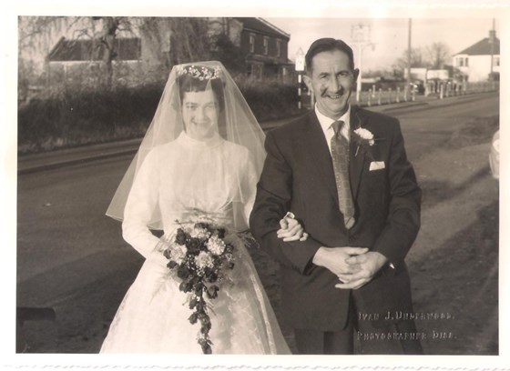 Mum and her Dad arriving at Church on her wedding day.