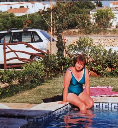 Enjoying her pool in the Menorcan sunshine.