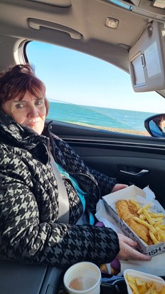 Enjoying fish 'n chips by seaside September 2023.