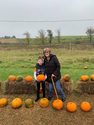 Grandma and Arran picking pumpkins