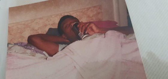 Maurice having a beer in bed 