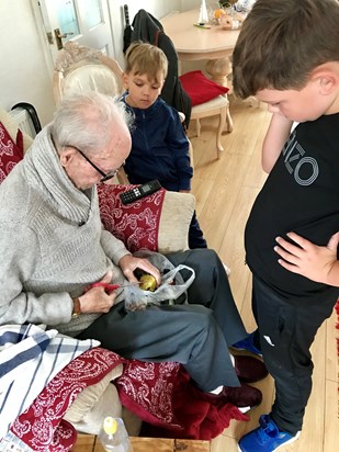 Cracking open the conkers we collected together by hitting then off the tree with your walking stick