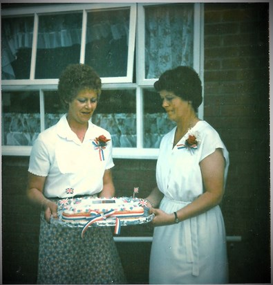 Virginia with her sister, Josephine, organising the cake for the Queen's Jubilee.