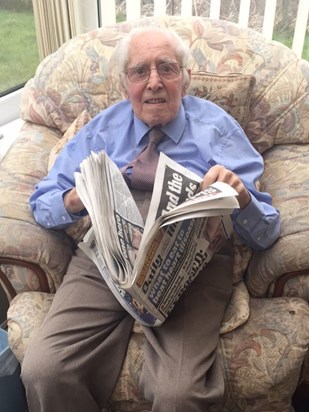 Dada loved a read of the paper in his chair