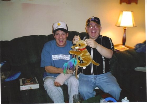 My brother Bob and my husband John having a blast with Bob's gag gifts!!!!! LOL