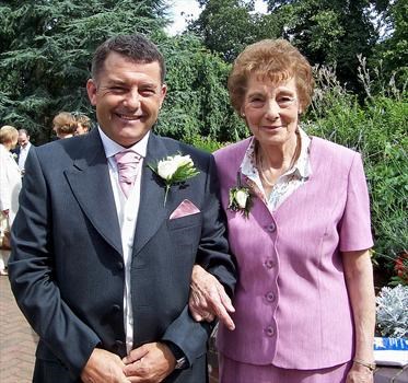 mum so proud with her son on his wedding day