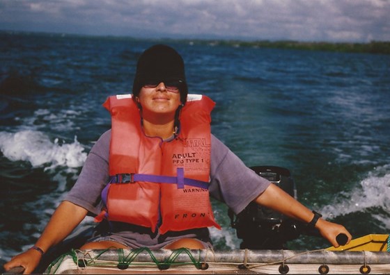 Capt. Karyn driving our tinny in Moreton Bay, Australia after trawling for fish!