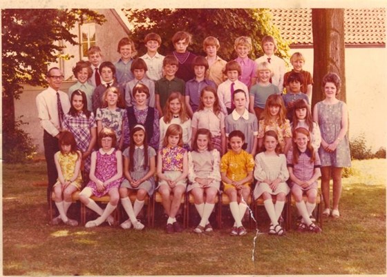 School Photo - Karyn on far left in white and purple tartan dress