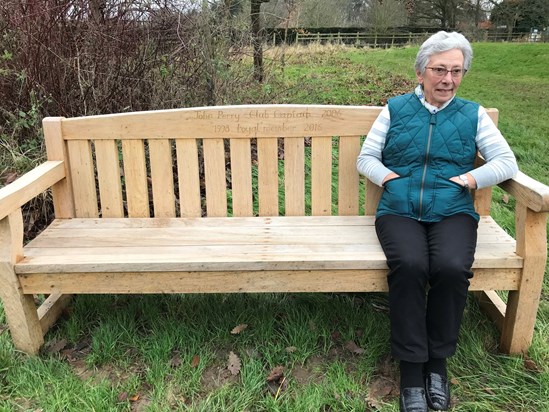 Mum sitting on Dad’s memorial bench at Bradfield College Golf Club
