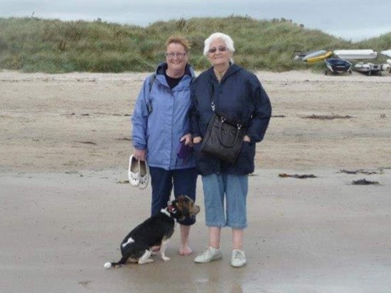 Sue, Muriel and Dexter on Beadnell beach.
