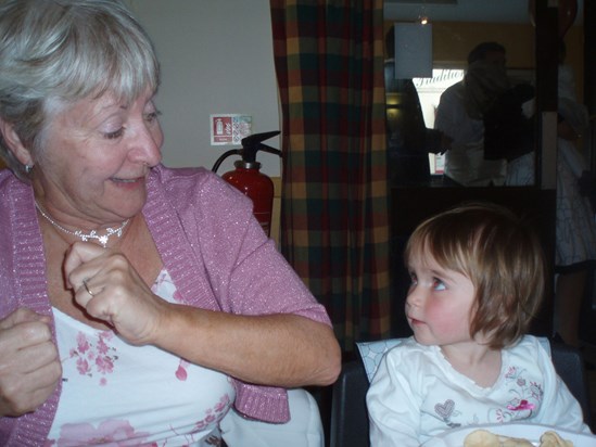 Nanny dancing with Lottie at a wedding