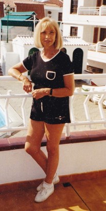 Beth on the balcony in Tenerife without sun glasses 1999.