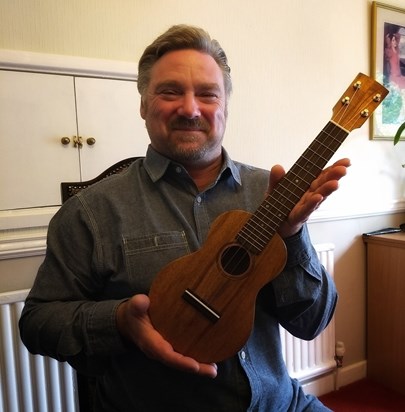 Dave Morgan with the beautiful ukulele he built and auctioned....