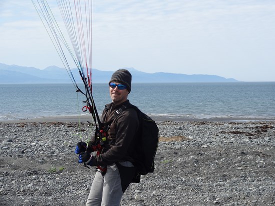 Kevin kiting his paraglider on the beach in Homer Alaska