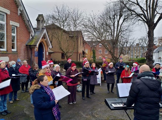 Jennie sing last Christmas in her beloved Choir she is in front of Chris with the F C hat