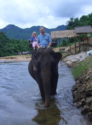 John riding an elephant. He loved elephants!